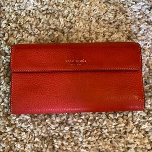 Kate Spade leather wallet. Red/orange color